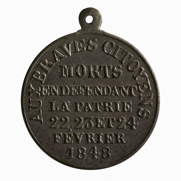 Bronzemedaille mit der Inschrift "Braves City Morts" vor weißem Hintergrund.