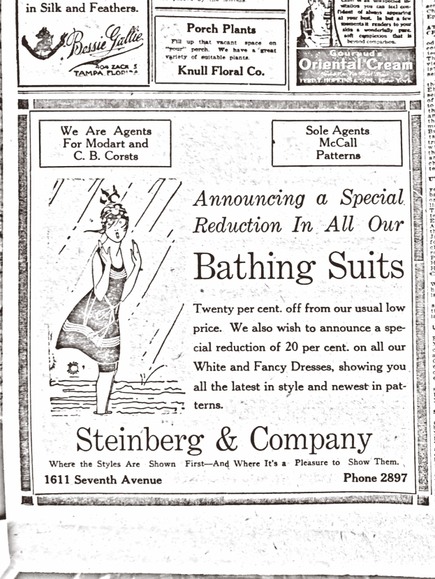 Eine Frau in einem weißen hochgeschlossenen, langärmligen Kleid mit ihrem Haar in einem Dutt, zentral in einer Werbung für Steinberg & Company's Badesachen stehend, umgeben von Text.