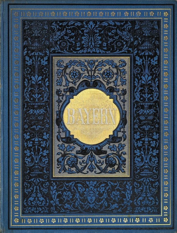 Ein blau-goldenes Buch mit der Aufschrift "Bayern", das mit detaillierten Verzierungen versehen ist.